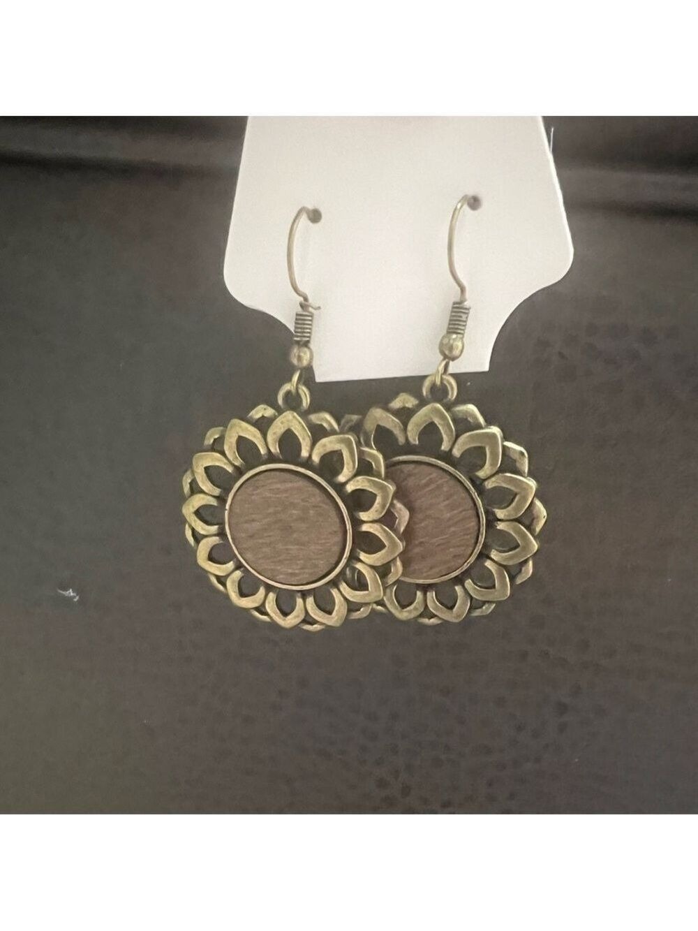 FASHION JEWELRY Copper colored flower with brown wooden circle in middle